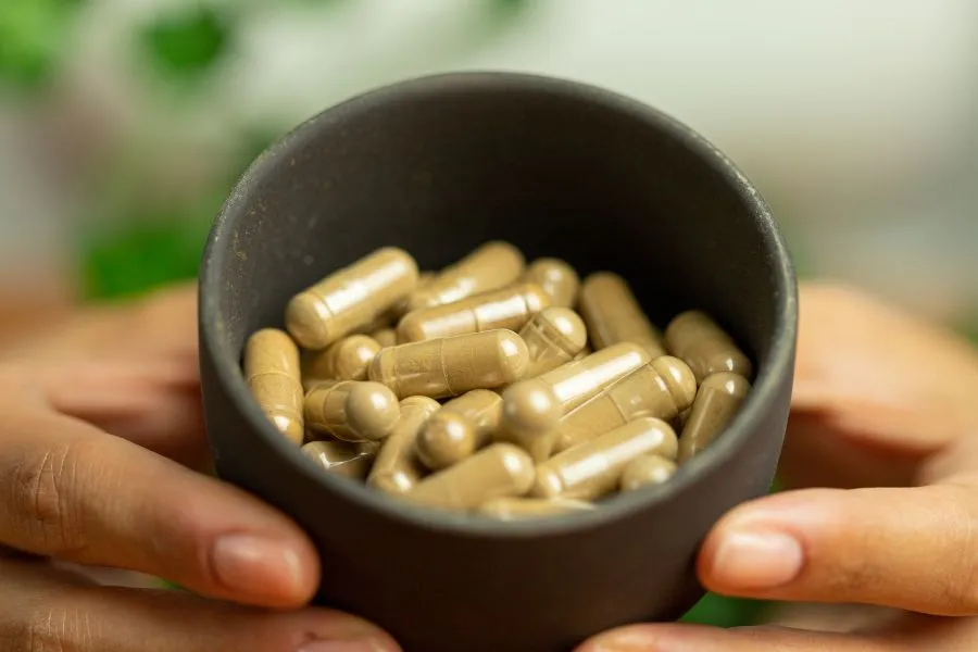 ashwagandha supplement capsules in a bowl